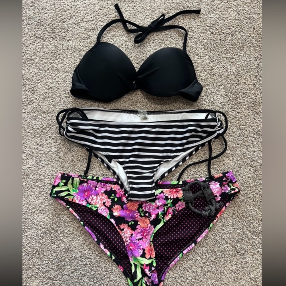 Women's size large bikini lot
Black Bikini Top with Striped and Floral Bottoms